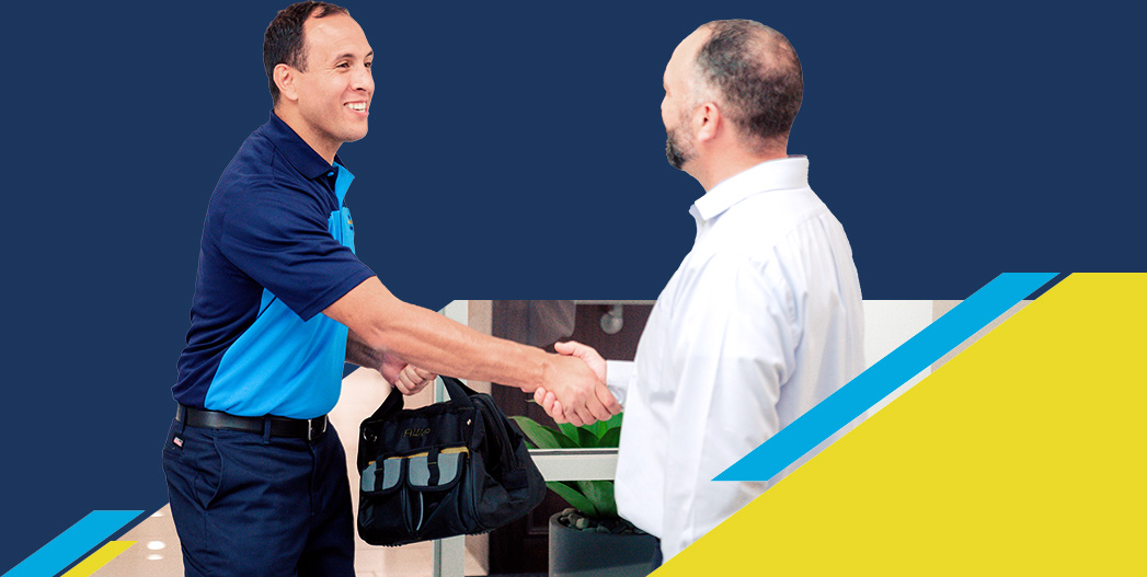 Z Plumberz technician shaking hands with a customer